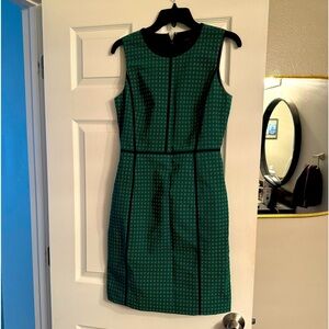 Cute sleeveless green dress with navy dots and lining